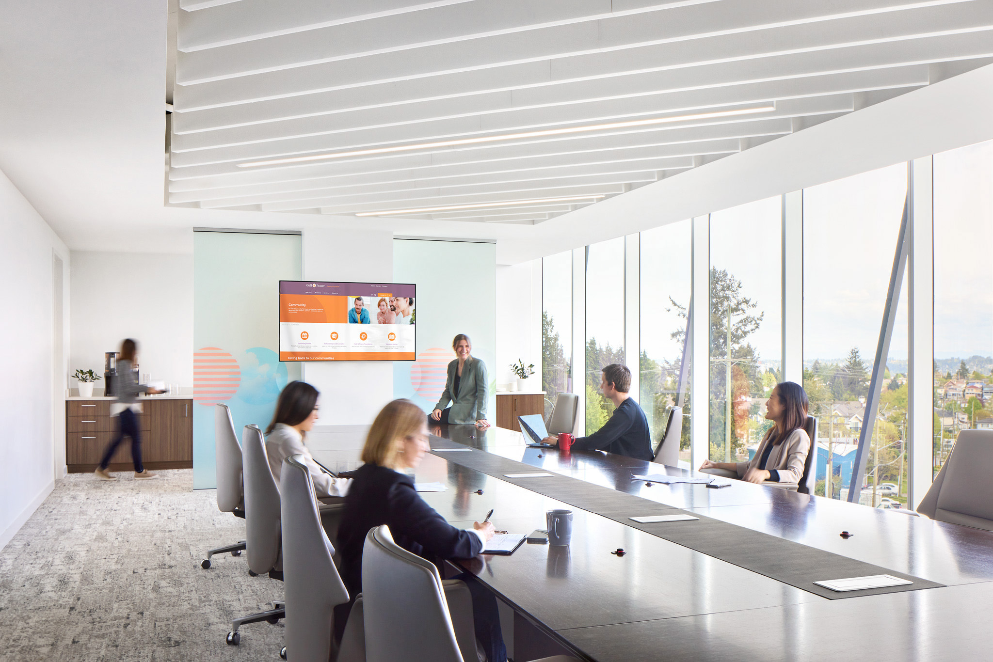 People In Corporate Boardroom With View