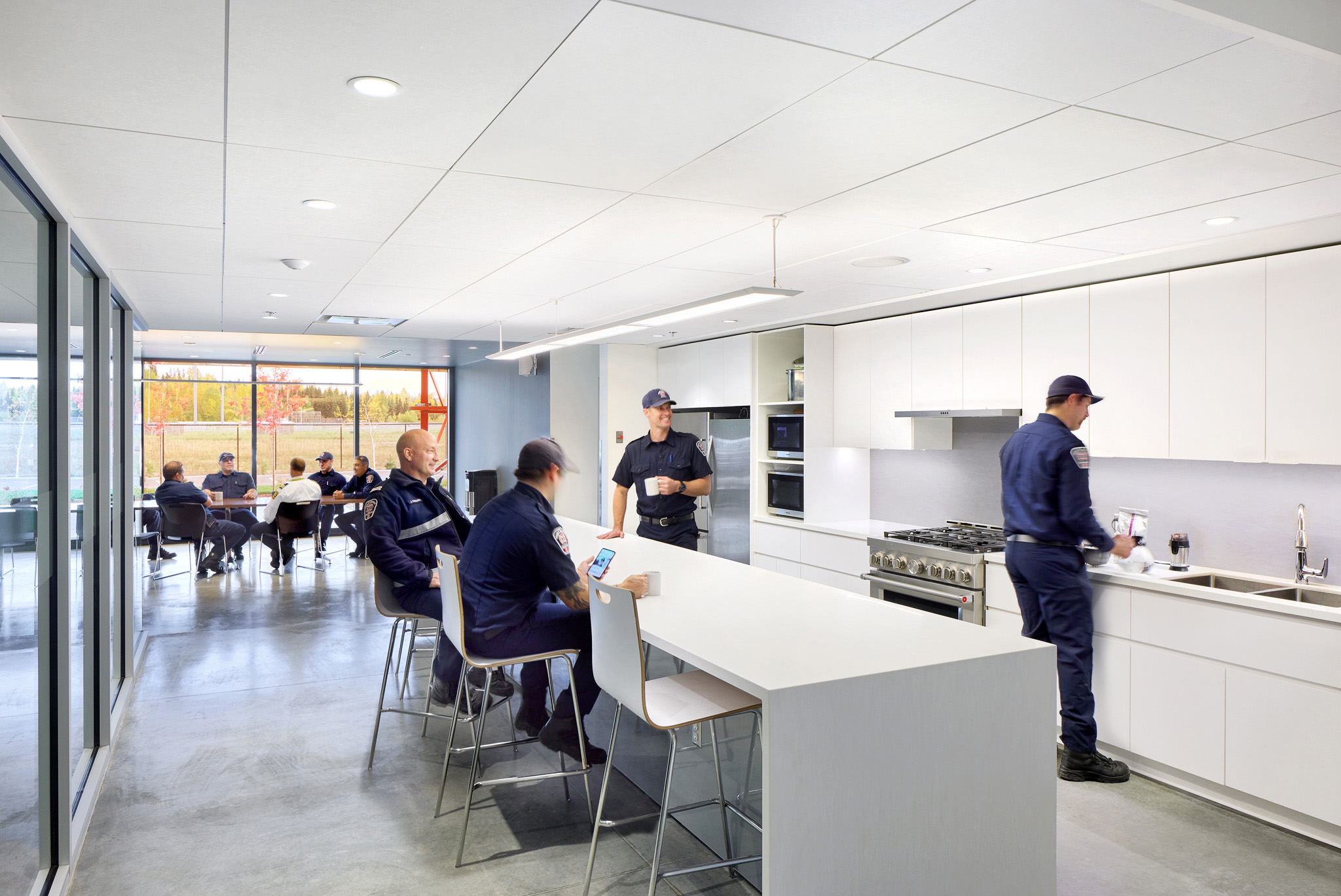 Firefighters in Kitchen And Dining Area Of Modern Firehall