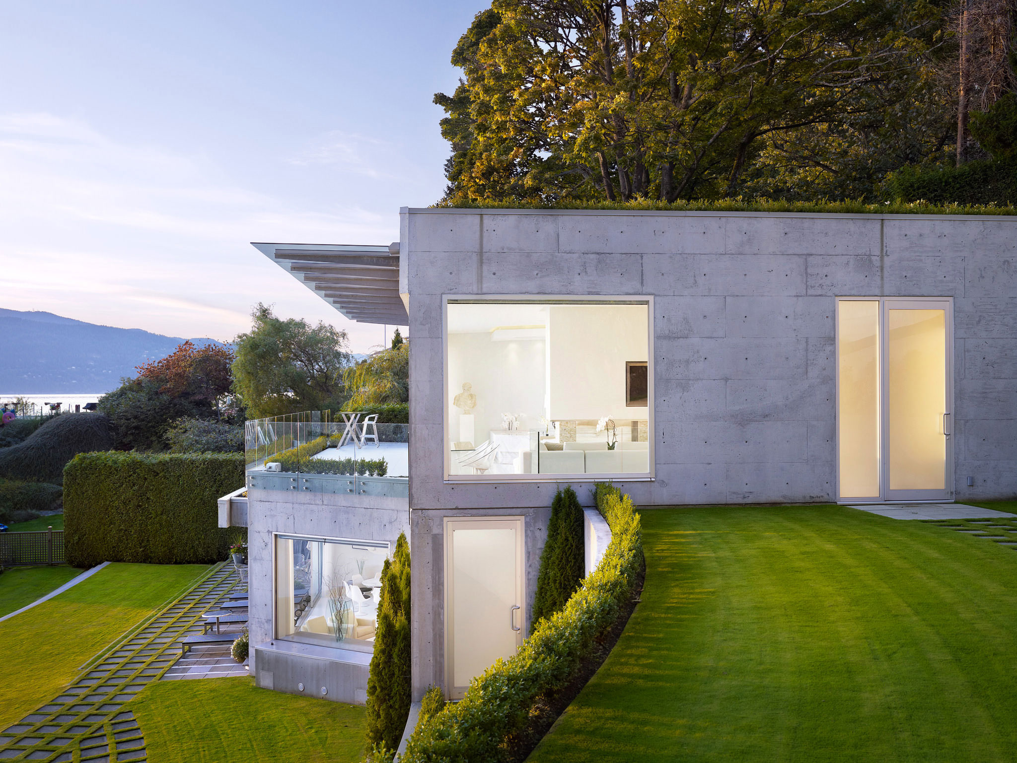 Sunset Exterior Of Small Modern Concrete Residence